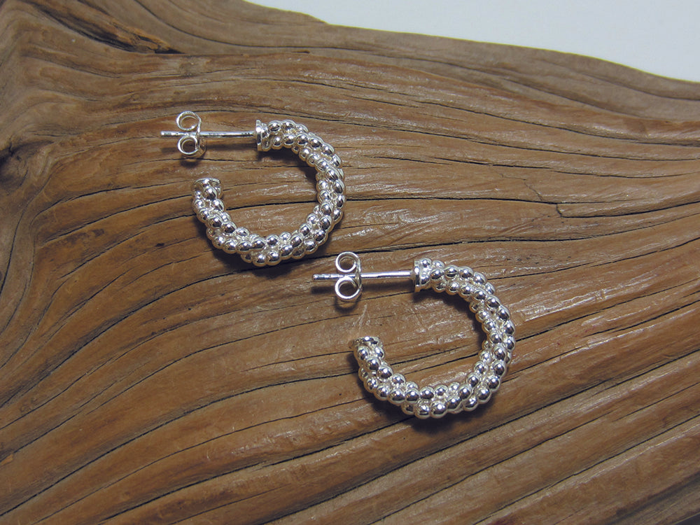 Twisted strings of tiny sterling silver beads make up these 18mm diameter hoop earrings. They would look great with all sorts of beaded necklaces and bracelets. 925 silver Canterbury