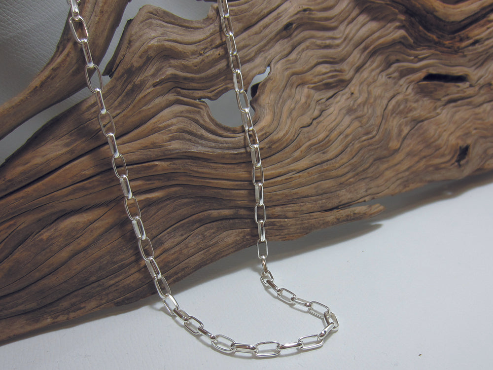 Classic style sterling silver rectangular belcher chain - each link is 8mm long and in total the necklace measures18" or 42cm. It has a t-bar fastening and weighs around 16.5 grams. 925 Silver