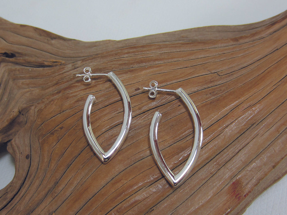 These round section, sterling silver, marquis shaped earrings are a nice twist on a traditional hoop. They are 32mm long. 925 Silver, Canterbury