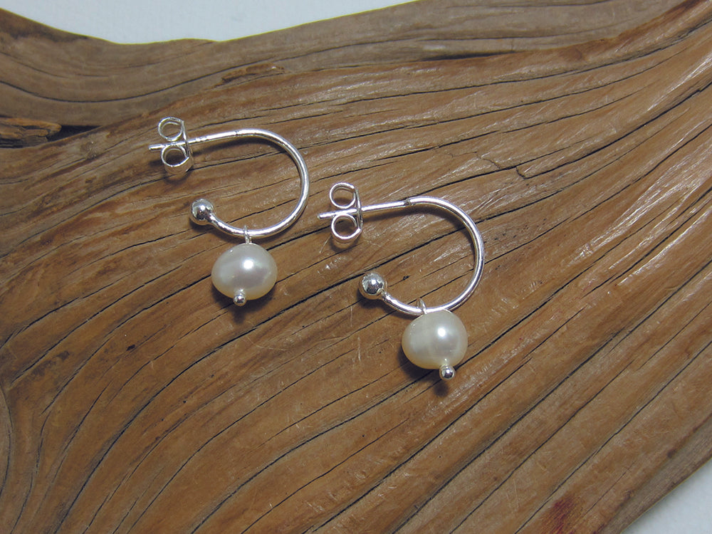 Small freshwater pearls hanging on a 12mm diameter sterling silver hoop. These are natural freshwater pearls so can vary slightly. 925 Silver Canterbury