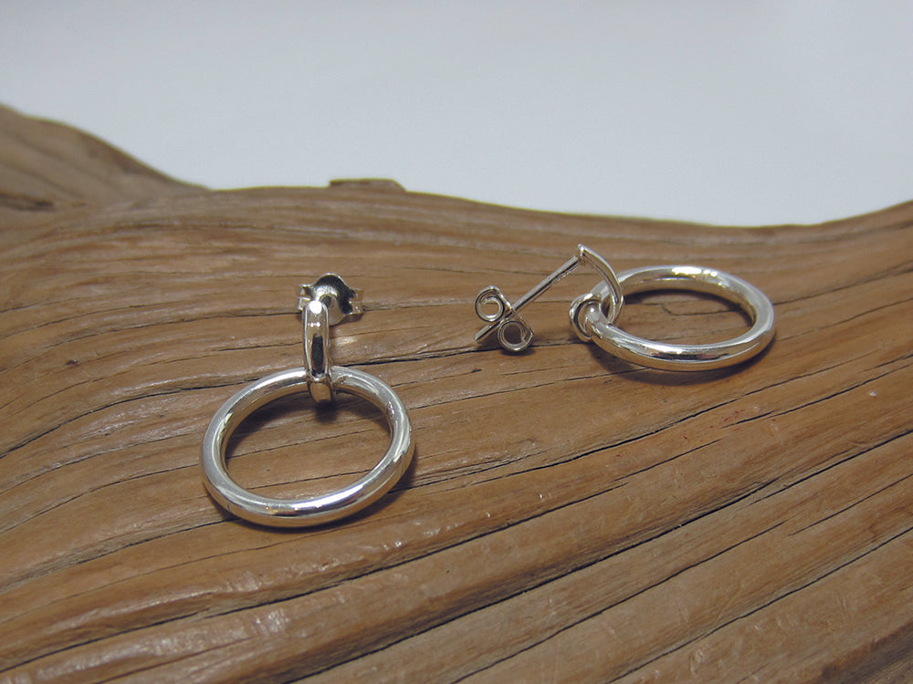Simple 15mm diameter sterling silver circle with a post and butterfly fastening. Small drop earring ideal for everyday use. 925 Silver, Canterbury