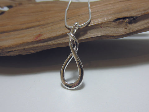 Entwined loop pendant. Great for everyday wear, this sterling silver pendant is 33mm long and 12mm wide.  925 Canterbury