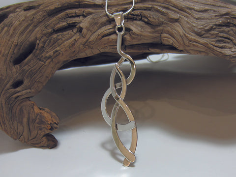The bold sterling silver pendant is 75mm long and about 20mm wide. It is shown here on a fine snake chain. 925 Canterbury