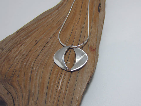 Great everyday, sterling silver pendant which is 25mm wide. It is shown here on a fine snake chain.