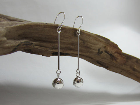 An 8mm bead hangs on a 30mm stem. Sterling silver drop earrings. 925 Canterbury
