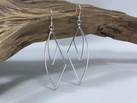 Double wire abstract drops, these lightweight sterling silver earrings are 50mm long and 20mm wide. 925 silver Canterbury