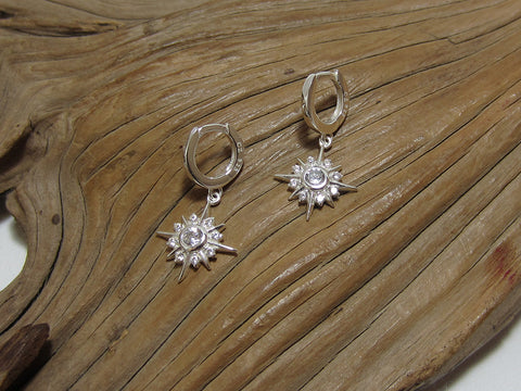 10mm sterling silver huggies with cubic zirconia starburst charms. 925 Canterbury