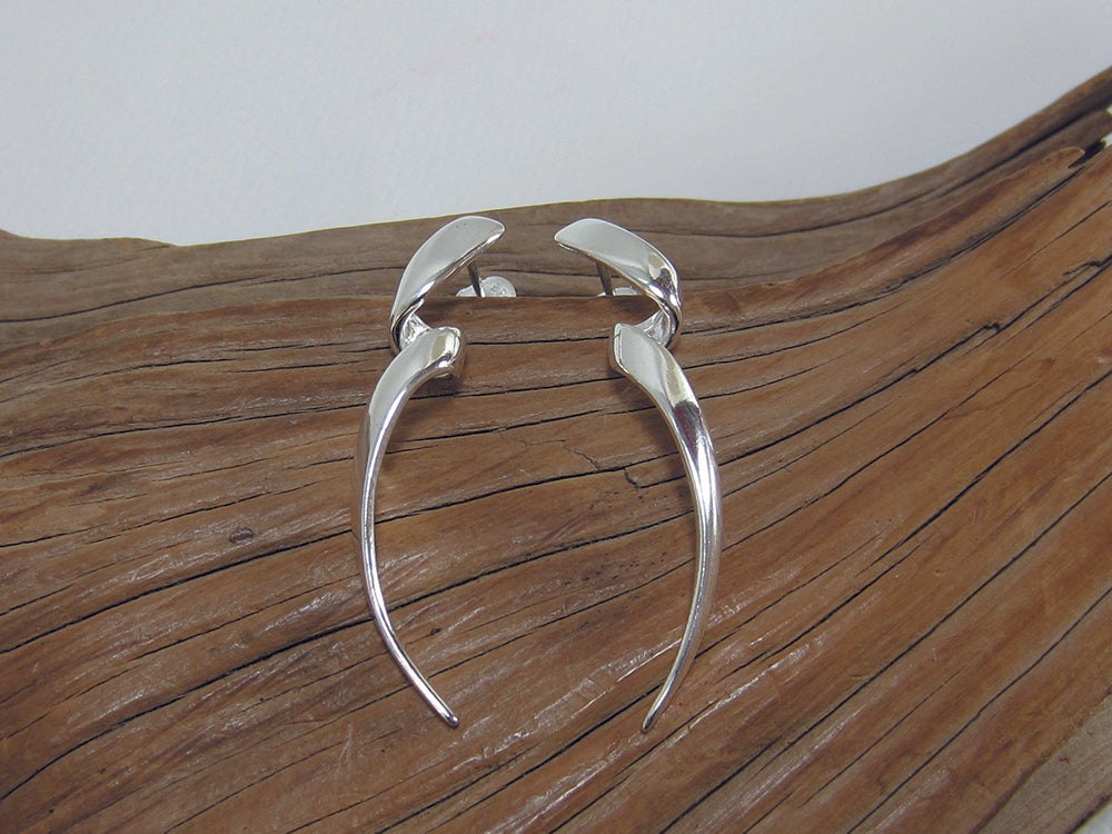 Long, twisty sterling silver drop earrings with a buttfly and post fastening. They are 40mm long. 925 Canterbury