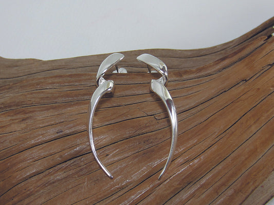 Long, twisty sterling silver drop earrings with a buttfly and post fastening. They are 40mm long. 925 Canterbury