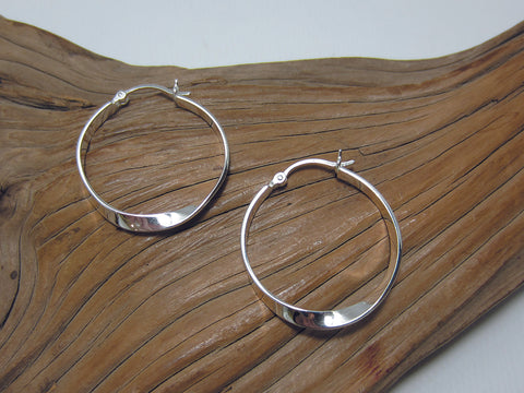 Completely plain, sterling silver hoop earring with a simple twist. They are 28mm in diameter, 3mm wide and have a creole style clasp. 925 Silver Canterbury
