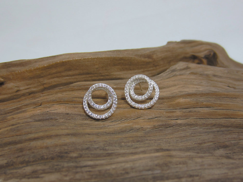 These cubic zirconia encrusted, sterling silver studs sparkle beautifully, they measure 11mm across. 925 Silver Canterbury