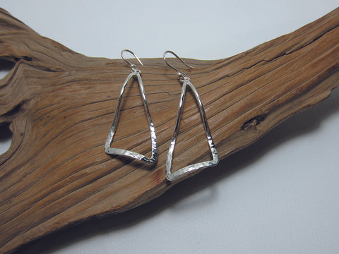A large undulating triangle with a hammered finish - which reflects the light beautifully. These sterling silver earrings are 50mm long and 32mm wide. 925 Silver Canterbury