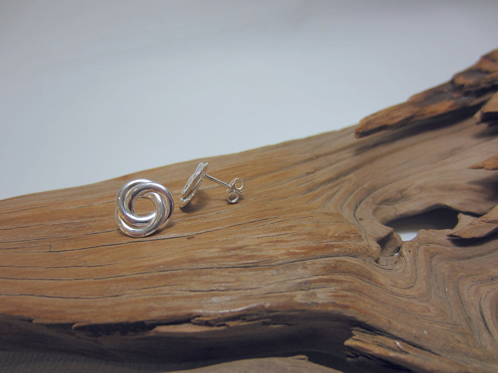 A large, sterling silver flat knot stud measuring 12mm across. 925 Silver Canterbury