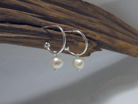 Small freshwater pearls hanging on a 12mm diameter sterling silver hoop. These are natural freshwater pearls so can vary slightly. 925 Silver Canterbury