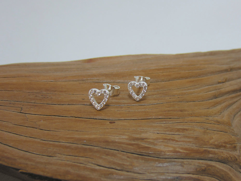 Cute little sterling silver outline heart studs set with cubic zirconias. They measure 6mm across. 925 Silver Canterbury