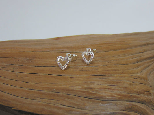 Cute little sterling silver outline heart studs set with cubic zirconias. They measure 6mm across. 925 Silver Canterbury