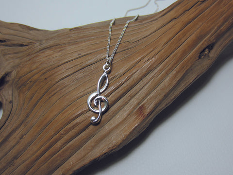 For music fans and musicians alike, this sterling silver pendant is 30mm tall and is shown here on a medium curb chain. 925 Silver Canterbury