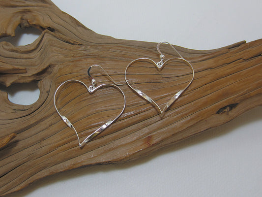 Nice, lightweight but bold twisty heart shaped earrings. Made from sterling silver they are 40mm wide. 925 Silver Canterbury