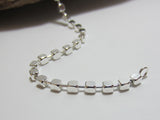 Made up of 3mm cubes this sterling silver bracelet is great for layering or wearing on it's own. It is 19.5cms long.